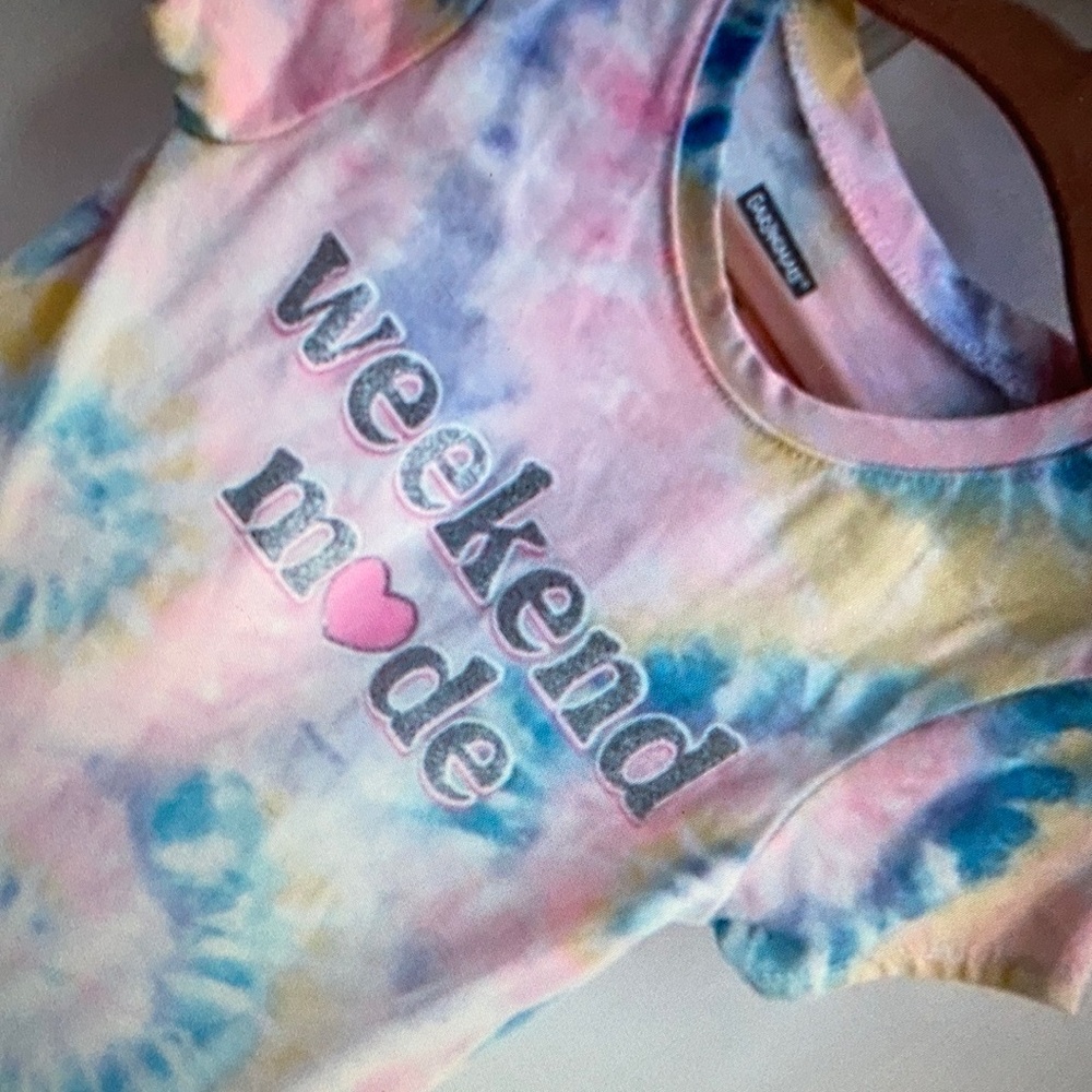 Playful spiral tie-dye pattern perfect for casual blouse